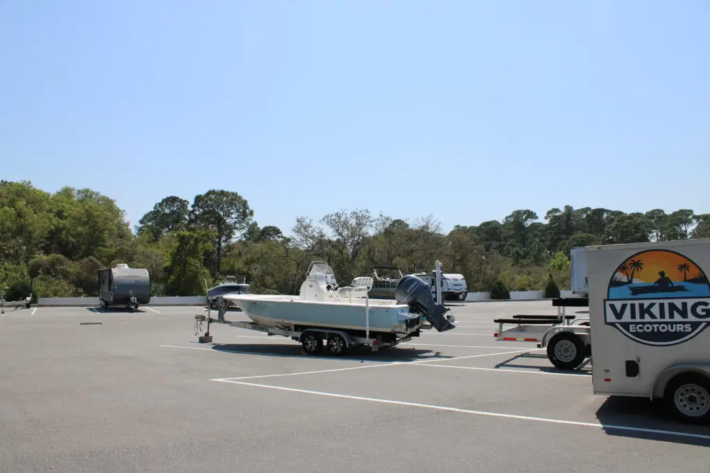 Boats on trailers parked in numbered open spaces at Park-4-Dayz
